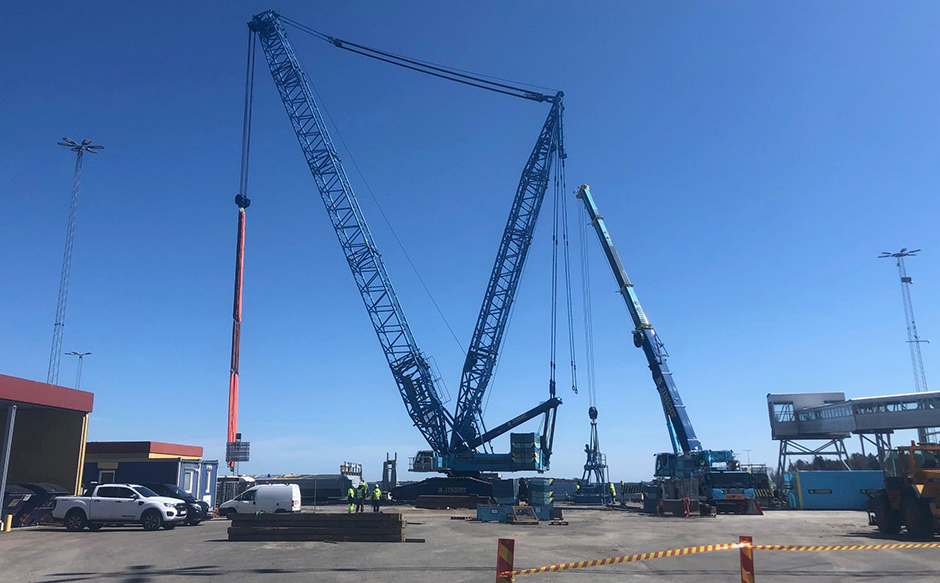 A large crane lifting the ramp